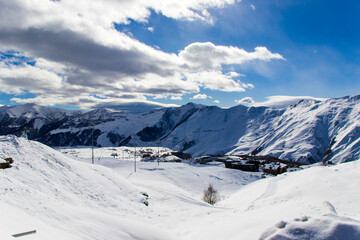 Fototapeta na wymiar Georgian ski resort in Gudauri. Snowy mountains.