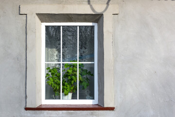 Obraz na płótnie Canvas Plastic window in an old house