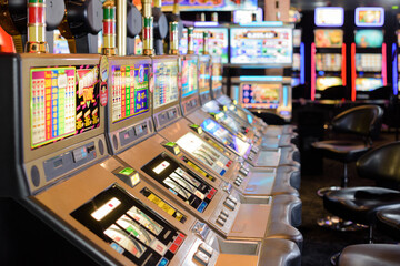close up of row of slot machines