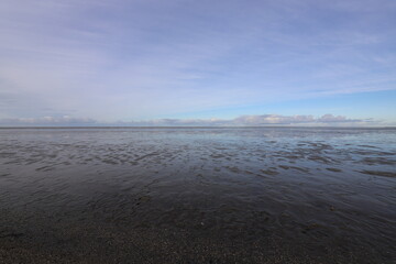 Shallow waters and a beautiful panoramic view - Wadden Sea, The Netherlands.