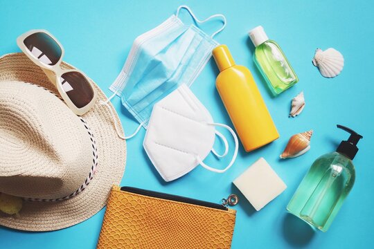 Summer Vacations 2021 During Coronavirus. Abroad Travelling In The Time Covid. Lifting International Travel Restrictions. Beach Essentials And Disposable Face Mask, Respirator And Sanitizer