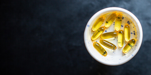 vitamin omega 3 or hyaluronic acid capsules dietary supplement active additive cosmetic purposes body's immunity ready to eat on the table for healthy meal snack top view copy space