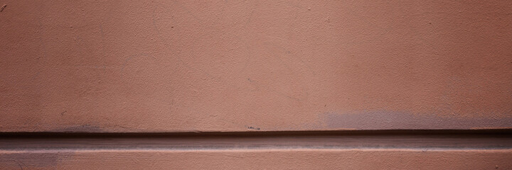 Fototapeta premium Decorative elements on the wall. Rough painted surface. Empty place for text, images and ads. Wide panoramic texture for background and design.