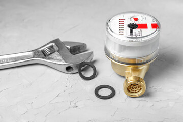 The counter of hot water and sliding the key on a concrete background. The concept of energy...