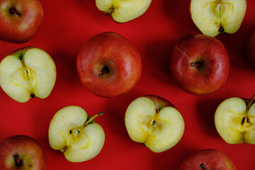 Red apples on the red background