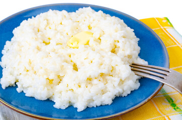 Delicious rice milk porridge in blue plate on white background