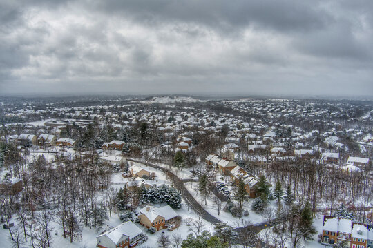 Aerial view of the Hunting Hills Woods neighborhood in Rockville, Montgomery County, Maryland, during a snowstorm.