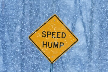 Speed hump sign in snow