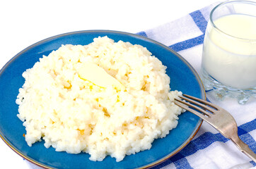 Delicious rice milk porridge in blue plate on white background