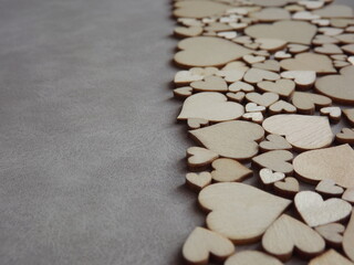 valentine's day greeting card-wooden hearts on a gray suede background. High quality photo
