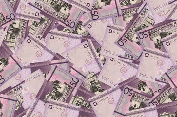 50 Dominican pesos bills lies in big pile. Rich life conceptual background