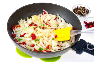 Frying pan with chopped cabbage, vegetable dishes