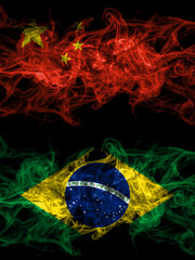 China, Chinese vs Brazil, Brazilian smoky mystic flags placed side by side. Thick colored silky abstract smoke flags.