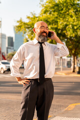 Asian businessman talking on the phone in an urban environment