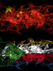 China, Chinese vs Comoros, Comorian smoky mystic flags placed side by side. Thick colored silky abstract smoke flags.