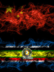 China, Chinese vs East African Community smoky mystic flags placed side by side. Thick colored silky abstract smoke flags.