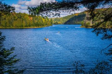 Fototapeta na wymiar View on the Wapizagonke lake in Mauricie National Park (Quebec, Canada), on a beautiful fall day