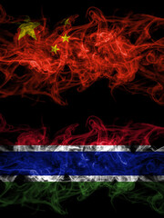 China, Chinese vs Gambia, Gambian smoky mystic flags placed side by side. Thick colored silky abstract smoke flags.