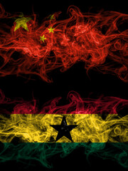 China, Chinese vs Ghana, Ghanaian smoky mystic flags placed side by side. Thick colored silky abstract smoke flags.