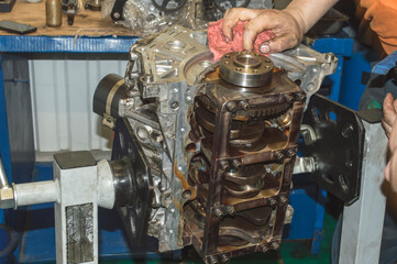 Bottom view of the engine, which is mounted on a special stand, when installing the piston