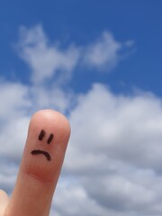 Sad-faced finger drawn, sky in the background. Related to sadness, crying, loss and other sad moods.
Useful as backgrounds in medical concepts, psychology, business, cartoons.