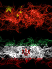 China, Chinese vs Iran, Iranian smoky mystic flags placed side by side. Thick colored silky abstract smoke flags.