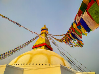 View of Boudhanath Stupa (or Bouddha Stupa) in the rays of the setting sun in Kathmandu city,...