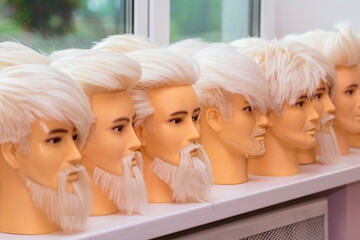 Male mannequins for training hairstyles.