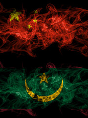 China, Chinese vs Mauritania smoky mystic flags placed side by side. Thick colored silky abstract smoke flags.