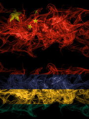 China, Chinese vs Mauritius smoky mystic flags placed side by side. Thick colored silky abstract smoke flags.