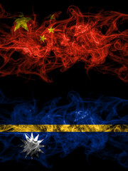 China, Chinese vs Nauru, Nauruan smoky mystic flags placed side by side. Thick colored silky abstract smoke flags.