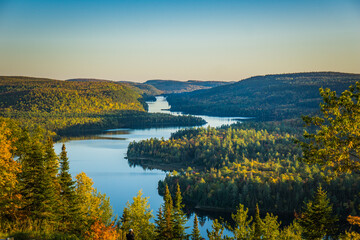 Fototapeta premium View on the Wapizagonke lake at sunset on a fall day from a belvedere in the Mauricie National Park (Quebec, Canada)