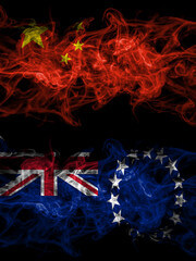 China, Chinese vs New Zealand, Cook Islands smoky mystic flags placed side by side. Thick colored silky abstract smoke flags.