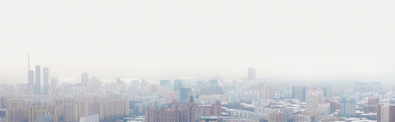 Fototapeta na wymiar Residential areas of Moscow during a snowstorm in winter. Panoramic view of winter Moscow, Russia