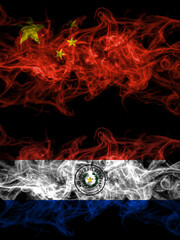 China, Chinese vs Paraguay, Paraguayan smoky mystic flags placed side by side. Thick colored silky abstract smoke flags.