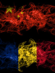 China, Chinese vs Romania, Romanian smoky mystic flags placed side by side. Thick colored silky abstract smoke flags.