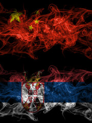 China, Chinese vs Serbia, Serbian smoky mystic flags placed side by side. Thick colored silky abstract smoke flags.