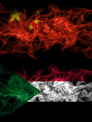 China, Chinese vs Sudan smoky mystic flags placed side by side. Thick colored silky abstract smoke flags.