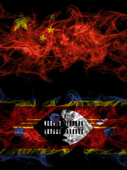 China, Chinese vs Swaziland smoky mystic flags placed side by side. Thick colored silky abstract smoke flags.