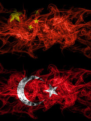 China, Chinese vs Turkey, Turkish, Turk smoky mystic flags placed side by side. Thick colored silky abstract smoke flags.