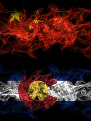China, Chinese vs United States of America, America, US, USA, American, Colorado smoky mystic flags placed side by side. Thick colored silky abstract smoke flags.