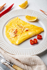 Chilli crab silky omlette , on plate, on white background