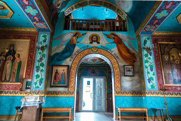 Fototapeta na wymiar Interior of an Orthodox Ukrainian church. Entrance to the Temple