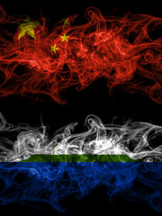 China, Chinese vs United States of America, America, US, USA, American, Navassa Island smoky mystic flags placed side by side. Thick colored silky abstract smoke flags.