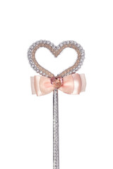 Magic wand isolated on white background. Beautiful silver and pink heart shaped stick decoration with Swarovski crystals.