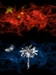 China, Chinese vs United States of America, America, US, USA, American, South Carolina smoky mystic flags placed side by side. Thick colored silky abstract smoke flags.