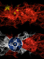 China, Chinese vs United States of America, America, US, USA, American, Wichita, Kansas smoky mystic flags placed side by side. Thick colored silky abstract smoke flags.