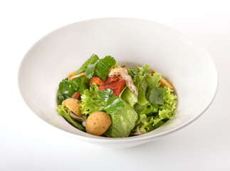 potato balls with cucumber on a white plate 