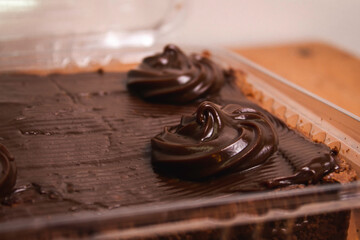close-up detail of the design of a decoration for a chocolate cake.