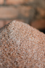 Small granules of crushed wheat close-up. Wheat background
